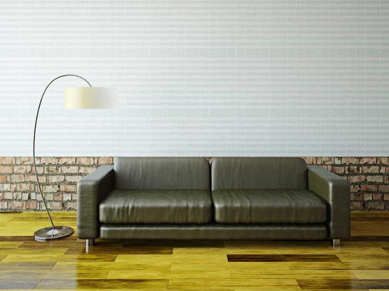 عکس مبل چرمی در کنار دیوار سنگی